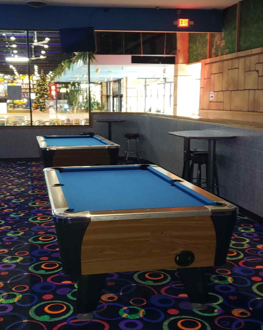 Two Pool table with funky carpets